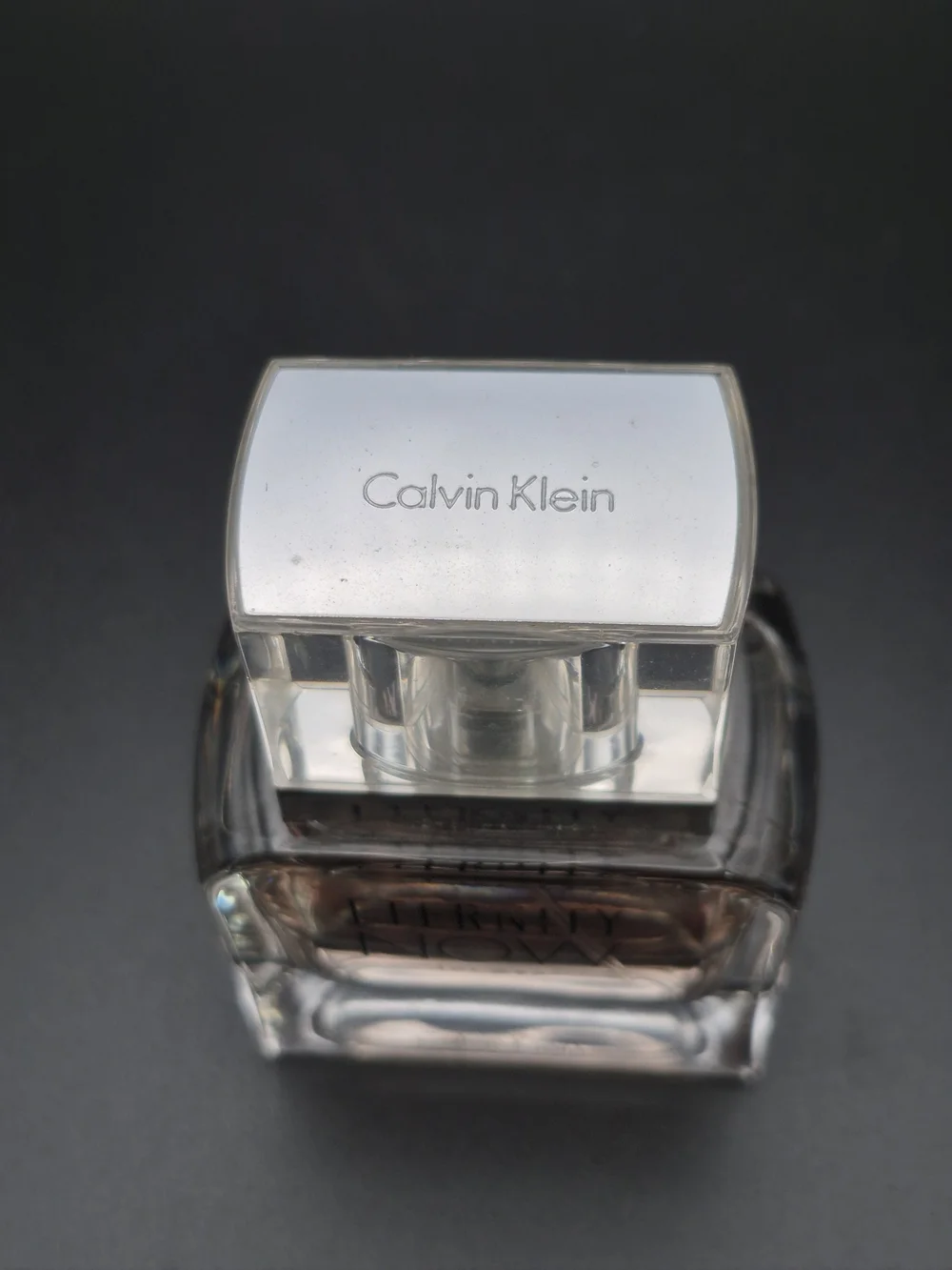 Calvin Klein Eternity Now for Men - Clear Glass Bottle with Pale Amber Liquid
